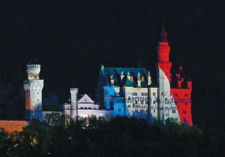 A CASTLE in Bavaria is illuminated in the tri-color. The author argues that terrorism seeks to bring the world back to the dark ages, when castles and human existence was brutish and religious zeal dictated the pattern of violence and life. (credit: REUTERS)