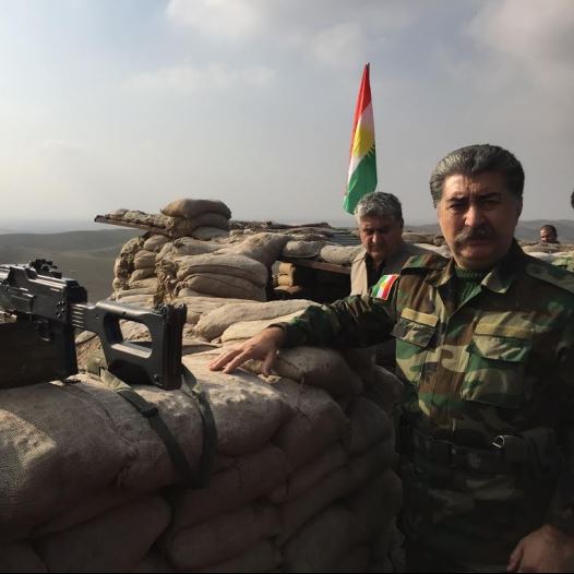 Hussein Yazdanpana, vice-president of the Kurdistan Freedom Party, speaking at the frontline with ISIS northeast of Kirkuk (credit: SETH J. FRANTZMAN)