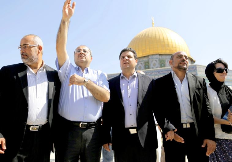 Lawmakers from the Joint Arab List stand in front of the Dome of the Rock during a visit to the compound in Jerusalem's Old City, July 28 (credit: REUTERS)