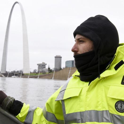 US Geological Survey (USGS) hydro technician Jason Carron assesses the Mississippi River flood waters in St. Louis (credit: REUTERS)