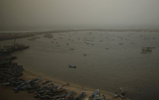 A view shows fishing boats at the seaport of Gaza City on a stormy day January 18, 2016.