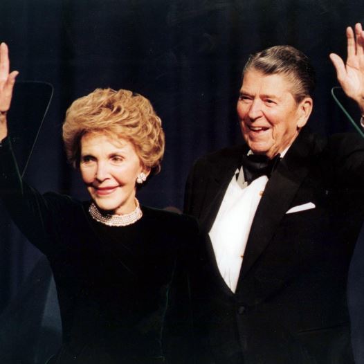 President Ronald Reagan and his wife Nancy wave while attending a gala celebrating his 83rd birthday, February 3, 1994 in Washington