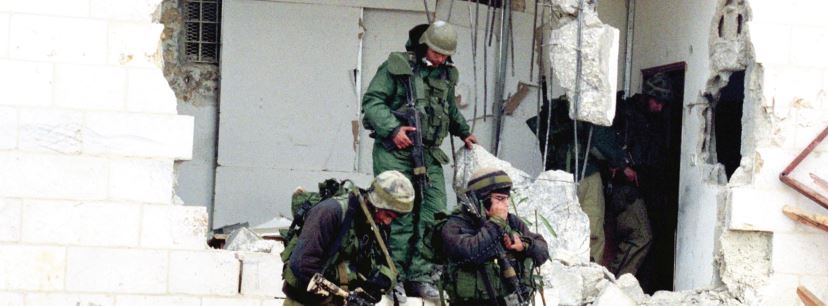IDF soldiers maneuver in Ramallah during Operation Defensive Shield in 2002 (credit: IDF SPOKESMAN'S OFFICE)