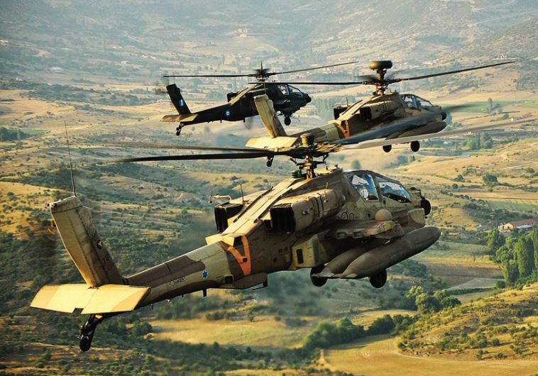 An Israel Air Force Apache helicopter lands across from a Greek mountain range during a joint Israel-Greece exercise with the Hellenic Air Force in October 2011 (credit: IAF)