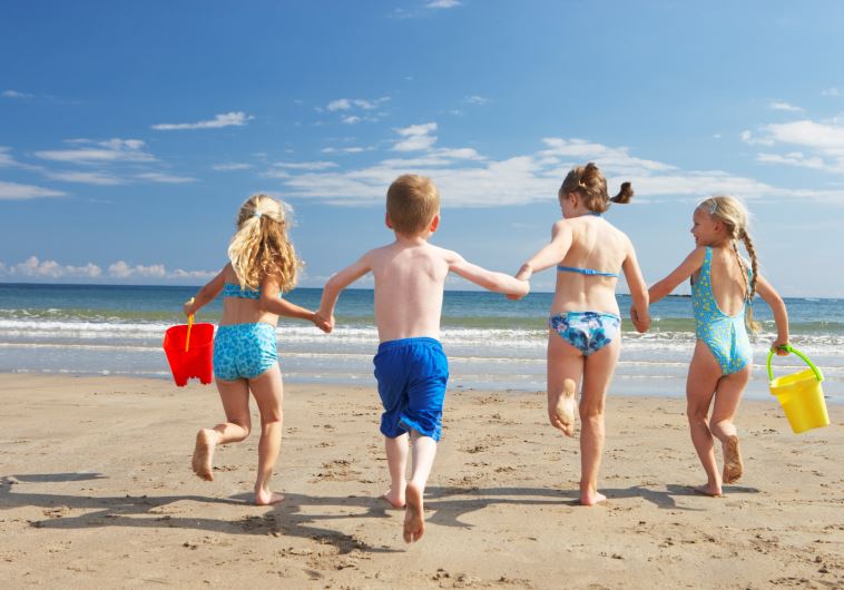 Children on beach vacation (illustrative) (credit: ING IMAGE/ASAP)