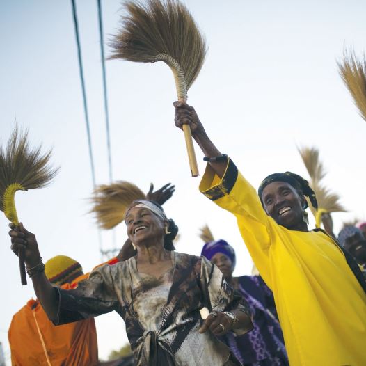 Members of the Black Hebrews dance as they take part in celebrations for Shavuot in Dimona