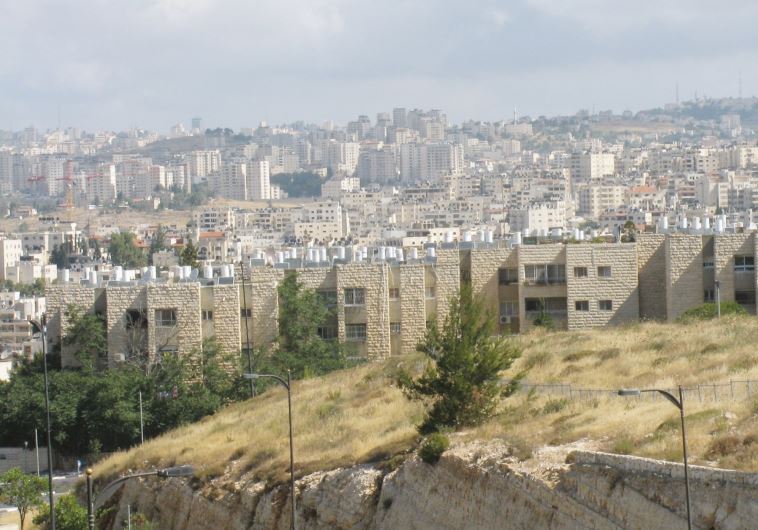 The Jewish neighborhood of Neveh Ya’acov with the settlement of Psagot in the background (credit: ANAV SILVERMAN)