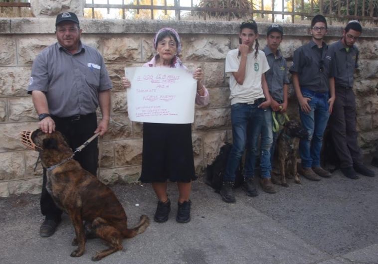  Mike Ben Yaakov, commander of the Israeli Dog Unit (left) stands next to Shifra Hoffman, founder of Victims Against Arab Terror International at a protest in front of the Prime Minister’s Residence in Jerusalem on Thursday evening. (credit: MARC ISRAEL SELLEM)