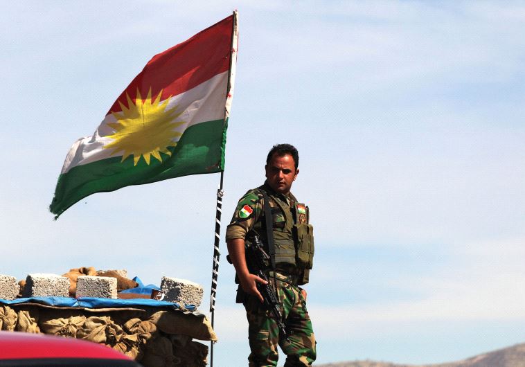 A KURDISH peshmerga soldier stands at a lookout near Bashiqa in northern Iraq (credit: REUTERS)