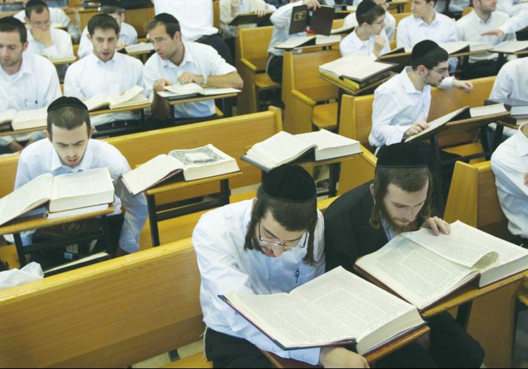 ULTRA-ORTHODOX STUDENTS study at Jerusalem’s Mir Yeshiva.