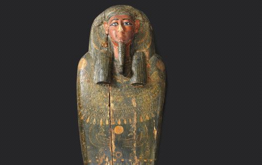 The lid of the mummy’s coffin sports characteristic ancient Egyptian stylized facial features and informative hieroglyphicsELIE POSNER