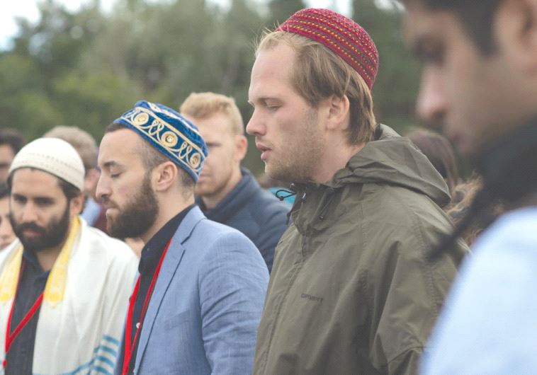PARTICIPANTS IN THE Muslim Jewish Conference take part in interfaith prayer last week at the site of the Sachsenhasuen concentration camp in Oranienburg, Germany (credit: DANIEL SHAKED)