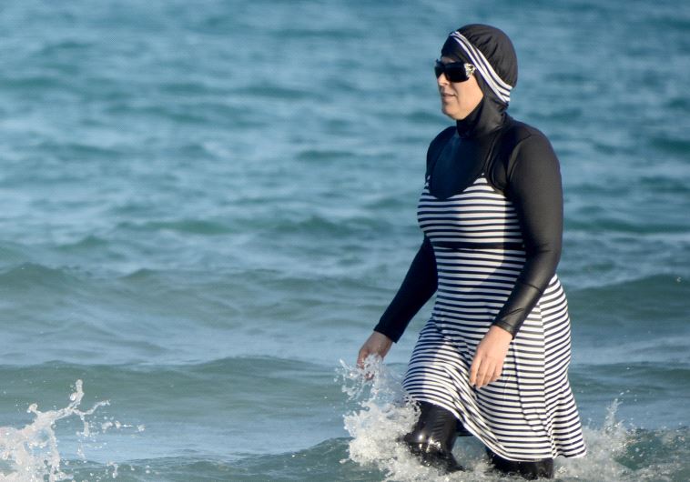 Tunisian women wearing a ''burkini (credit: FETHI BELAID/AFP)