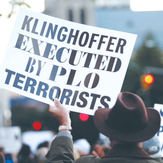 A PROTESTER holds up a sign condemning the Palestine Liberation Organization for the murder of Leon Klinghoffer (credit: REUTERS)