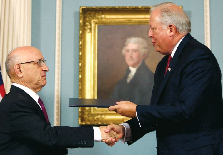 US Undersecretary of State Tom Shannon (R) and Israeli Acting National Security Advisor Jacob Nagel (L) shake hands after participating in a signing ceremony for a new ten year pact on security assistance between the two countries, in Washington (credit: REUTERS)