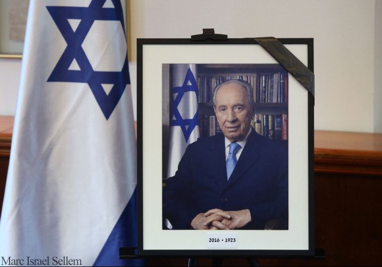 A framed photograph comemmorating former president Shimon Peres, who died on September 28, 2016 (photo credit: MARC ISRAEL SELLEM/THE JERUSALEM POST)