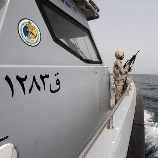 A Saudi border guard watches as he stands in a boat off the coast of the Red Sea on Saudi Arabia's maritime border with Yemen, near Jizan April 8, 2015. (credit: REUTERS)
