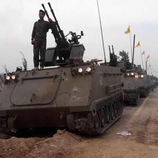 Hezbollah’s first-ever military parade on foreign soil, held in the Syrian city of Qusayr. (credit: ARAB SOCIAL MEDIA)