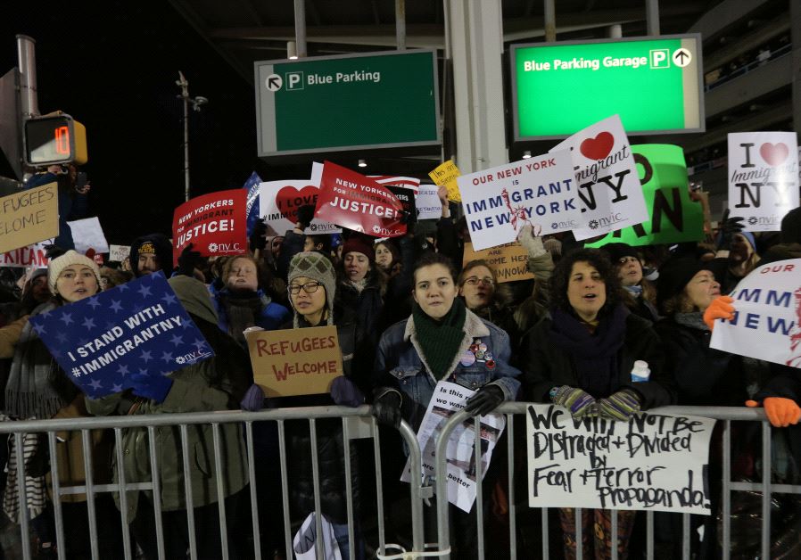 Protesters gather outside Terminal 4 at JFK airport in opposition to U.S. president Donald Trump's proposed ban on immigration in Queens, New York City, US, January 28, 2017 (credit: REUTERS)