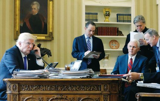 President Donald Trump, joined by (left to right) Chief of Staff Reince Priebus, Vice President Mike Pence, senior adviser Steve Bannon, Communications Director Sean Spicer and National Security Advisor Michael Flynn (credit: REUTERS)