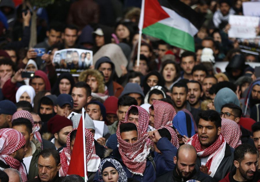 Palestinians demonstrate in the centre of the West Bank city of Ramallah against PA security forces (credit: ABBAS MOMANI / AFP)