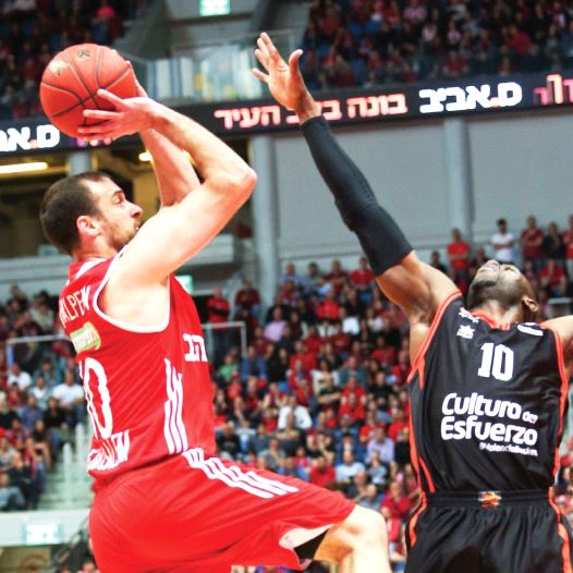 Hapoel Jerusalem captain Yotam Halperin (left) aims to build on his impressive performance in Game 2 of the Eurocup semifinals when the team visits Romain Sato (right) and Valencia and in the decisive contest of the series tonight in Spain. (credit: DANNY MARON)