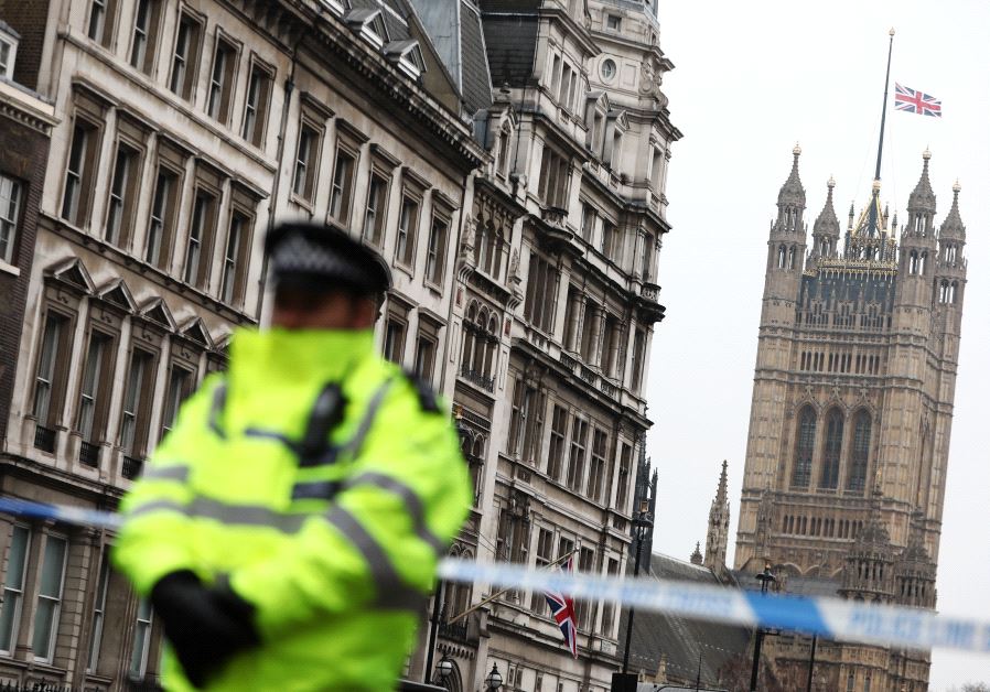 Police officers work at the scene after an attack on Westminster Bridge in London, Britain, March 22, 2017