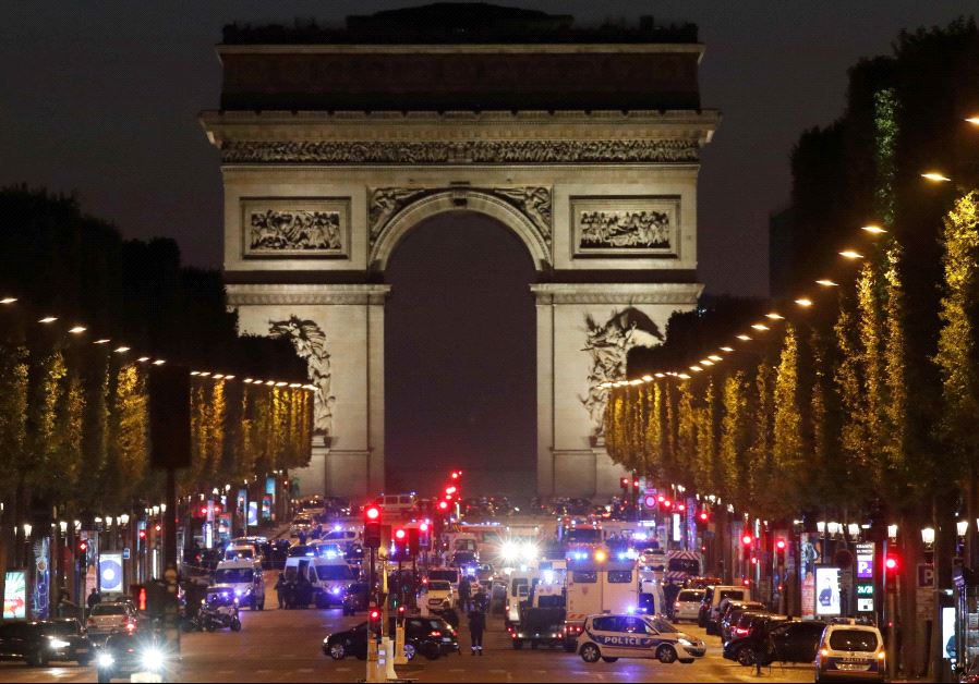 Police secure the Champs Elysees Avenue after a shooting incident in Paris, France (credit: REUTERS)