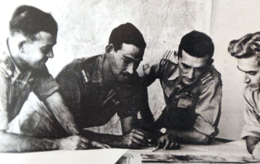 Harold ‘Smoky’ Simon (second left, inset) goes over plans with then-Israel Air Force commander Aharon Remez (left) and two unidentified serviceman during the War of Independence. (credit: Courtesy)