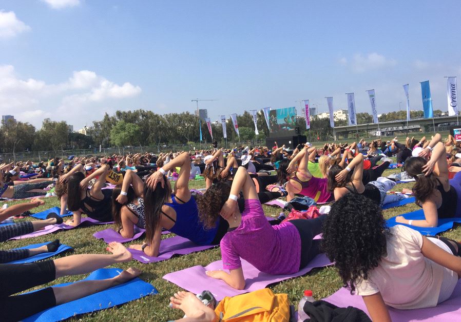 Israeli fitness buffs gather in Tel Aviv to hold the biggest Pilates class ever in Israel