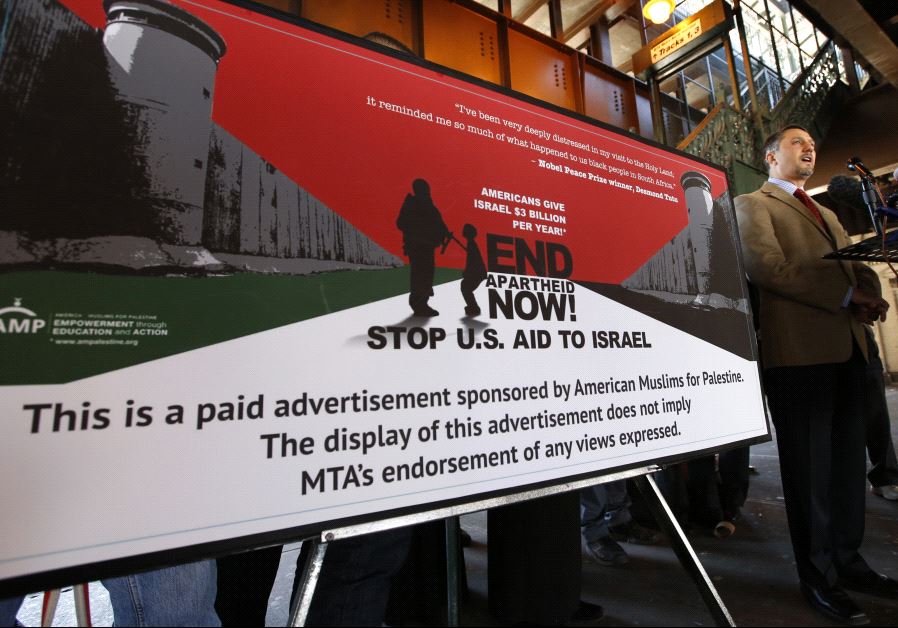 Dr. Hatem Bazian, Chairman of American Muslims for Palestine (AMP) speaks at a news conference next to one the organization's new advertisements at the Metropolitan Transit Authority (MTA) Harlem 125th Street Metro North commuter train station in New York City, March 26, 2013.