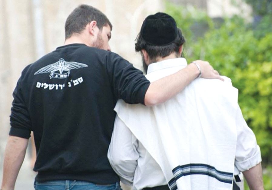 A secular and religious Jew walk arm in arm as a celebration of Jewish unity (credit: KAREN ABRAMSON)