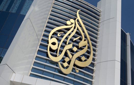 The logo of Al Jazeera Media Network is seen on its headquarters building in Doha, Qatar June 8, 2017. (credit: REUTERS/NASEEM ZEITOON/FILE PHOTO)