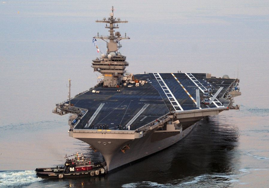 The Nimitz-class aircraft carrier USS George H.W. Bush (CVN 77) departs Naval Station Norfolk, Virginia, for its maiden deployment, May 11, 2011. (credit: REUTERS/NICHOLAS HALL/U.S. NAVY/HANDOUT)