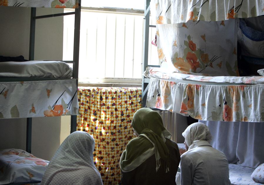 Iranian women prisoners sit at their cell in Tehran's Evin prison June 13, 2006.  (credit: REUTERS)