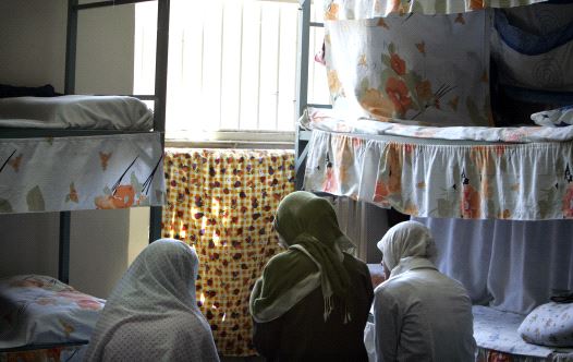 Iranian women prisoners sit at their cell in Tehran's Evin prison June 13, 2006.
