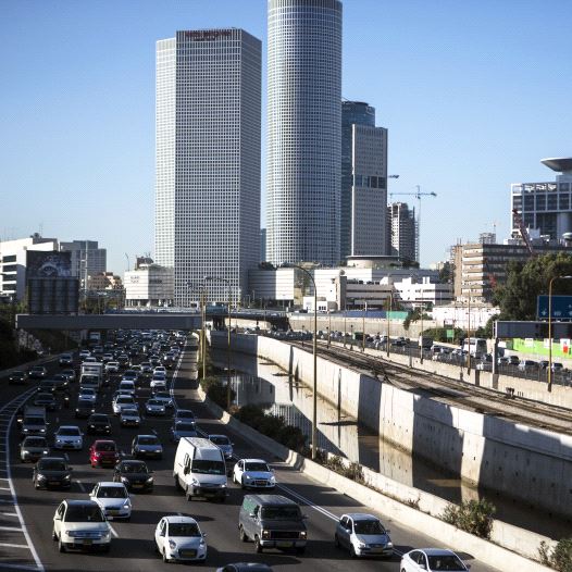Vehicles drive on a highway in the central Israeli city of Tel Aviv December 17, 2013.  (credit: REUTERS)