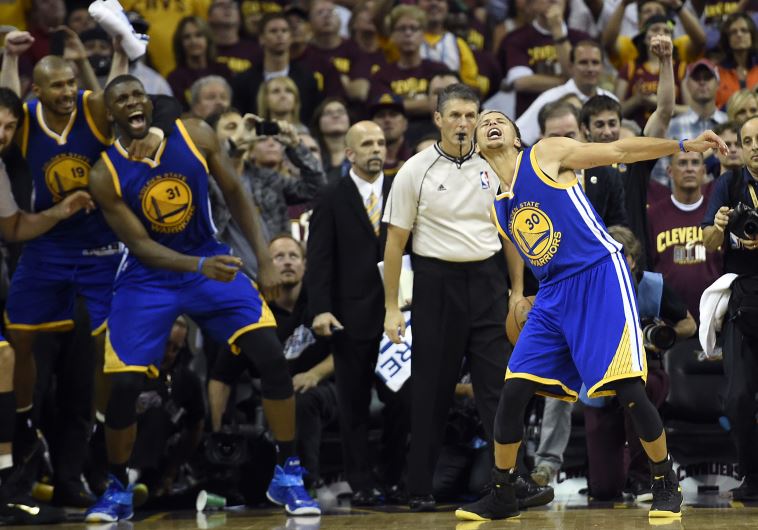Golden State Warriors guard Stephen Curry (30) celebrates winning in game six of the NBA Finals against the Cleveland Cavaliers at Quicken Loans Arena