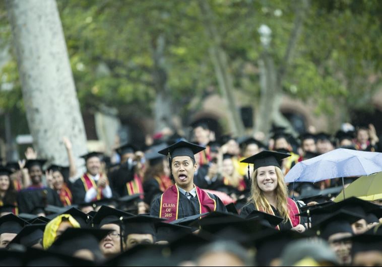 Graduating students walk to their seats during USC’s Commencement Ceremony at University of Southern California in Los Angeles, California May 15, 2015.