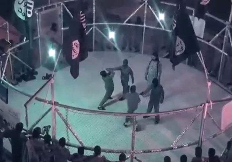 ISIS video shows young recruit fighting in cage‏