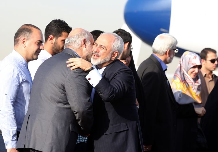 Zarif greeted by Iranian officials as he returns from nuclear talks in Vienna