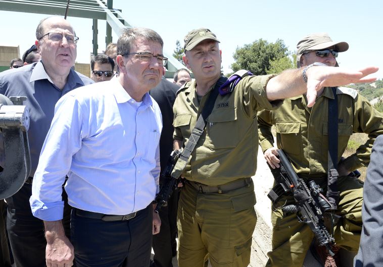 US Defense Secretary Ash Carter together with Ya'alon recieves a briefing from Brigadier General Muni Katz at Hussein Outlook, northern Israel, on July 20, 2015.