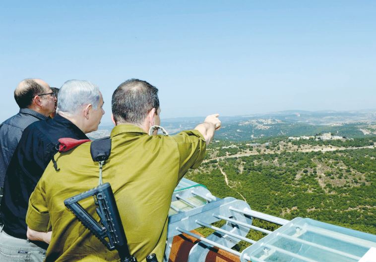 PRIME MINISTER Benjamin Netanyahu and Defense Minister Moshe Ya’alon tour the norther border of Israel yesterday with OC Northern Command Maj.-Gen. Aviv Kochavi.