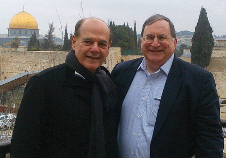 CESAR ALVAREZ (left) poses with Gary Epstein, head of the Israeli office of Greenberg Traurig, in Jerusalem’s Old City.