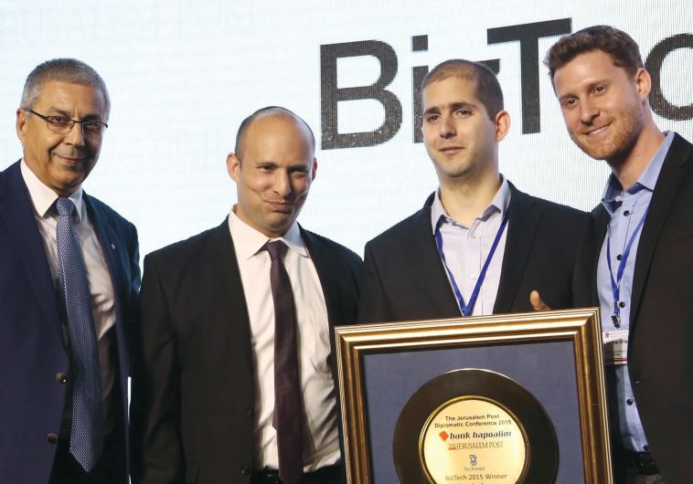 BANK HAPOALIM president and CEO Zion Kenan (left) and Education Minister Naftali Bennett (second from left) present the bank’s annual prize for technological innovation yesterday to Peakaboo founders Yoel Angel (second from right) and Lior Har-Shai.