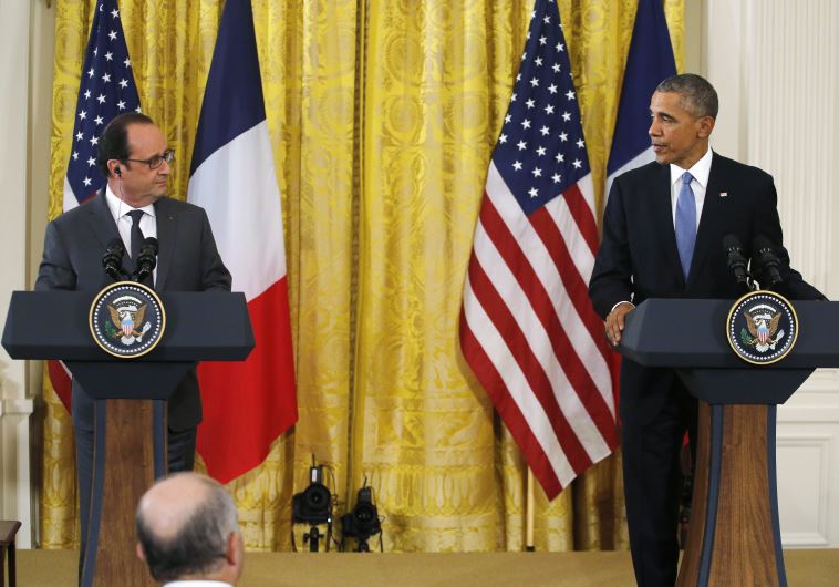 Barack Obama (R) and Francois Hollande hold a joint news conference in the East Room of the White House in Washington on November 24, 2015