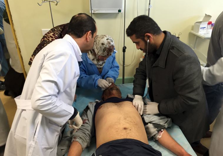 An injured man receives treatment inside a hospital in Misurata, Libya January 7, 2016 after one of Libya's worst truck bombs in years exploded at a police training center in the town of Zliten. 