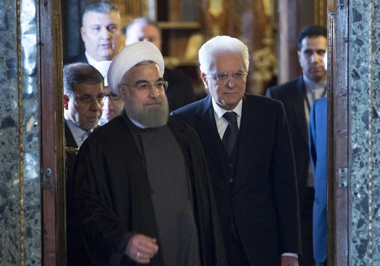 Iran's President Hassan Rouhani (L) walks next to his Italian counterpart President Sergio Mattarella at the Quirinale presidential palace in Rome, Italy, January 25, 2016