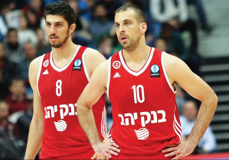 Hapoel Jerusalem guard Yotam Halperin (right) and forward Lior Eliyahu react after their team was eliminated from Eurocup