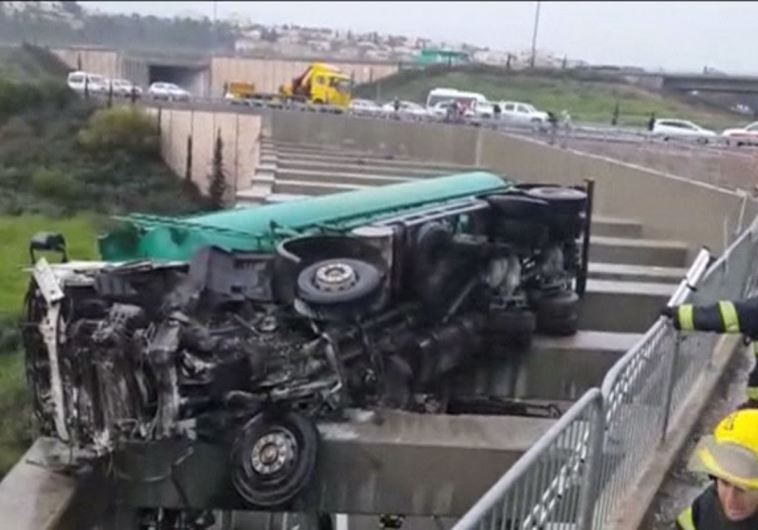 Child rescued after hanging from overturned truck